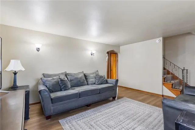 a kitchen with stainless steel appliances granite countertop a refrigerator a sink a stove and island