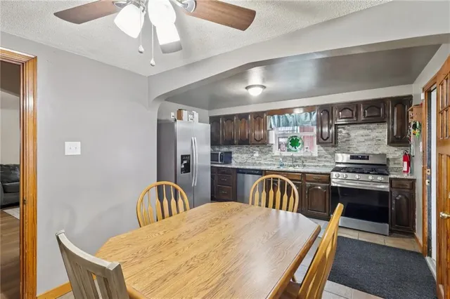 a bedroom with a bed and a lamp