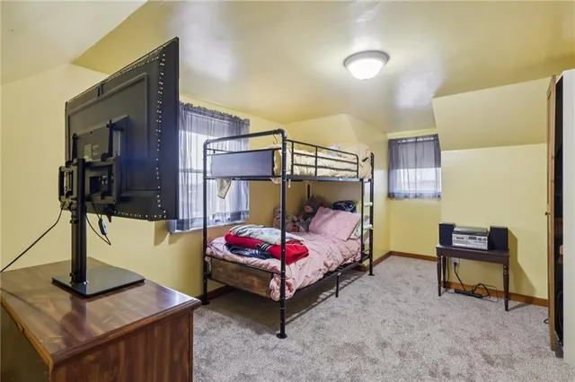 a front view of a house with a yard table and chairs