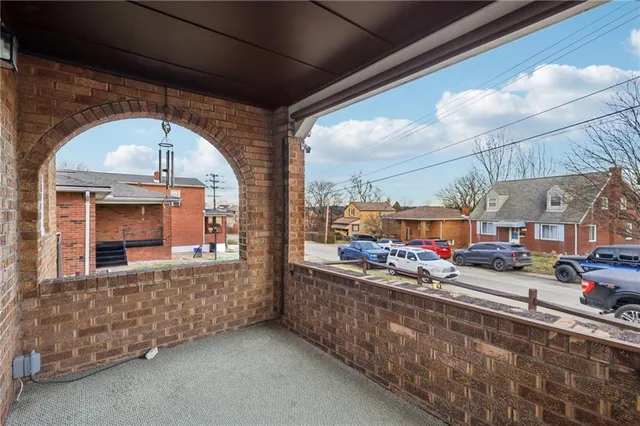 a living room with furniture and a lamp
