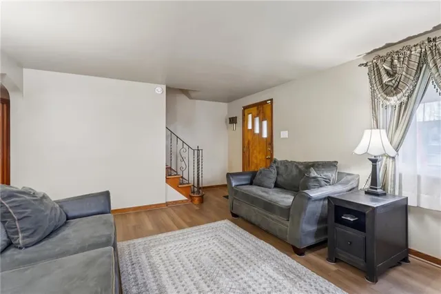 a view of a dining room with furniture and a chandelier