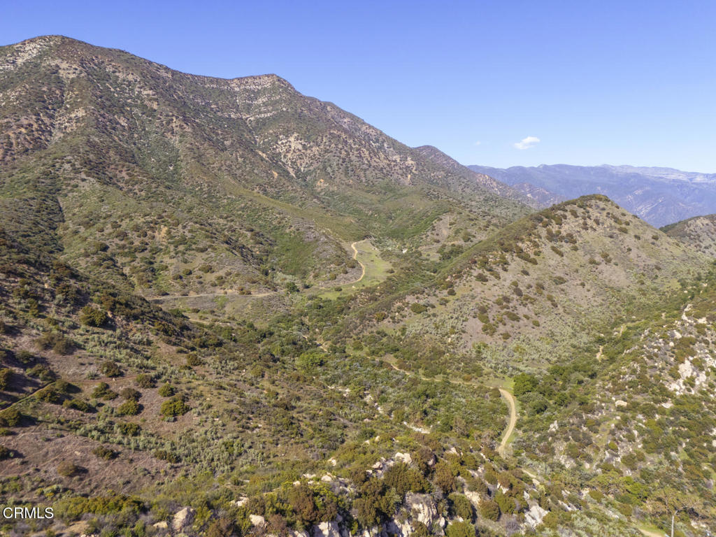 1797 Foothill Road Ojai, CA 93023 - Photo 14 of 27 a view of a mountain range in a cloudy sky