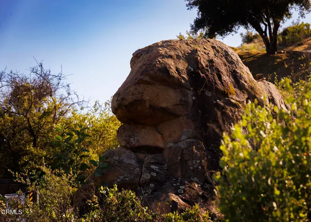 an aerial view of residential house and sandy dunes