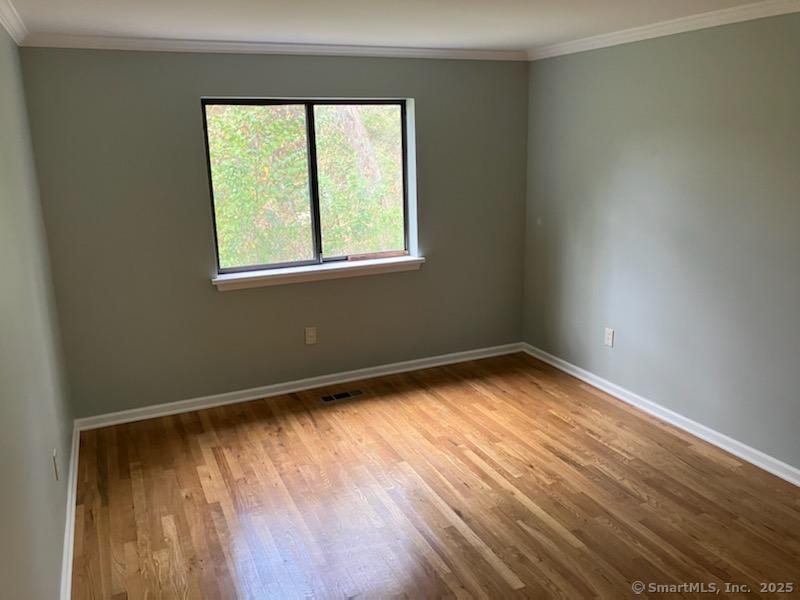 115 Fillow Street, Unit 61 Norwalk, CT 06850 - Photo 9 of 11 an empty room with a window