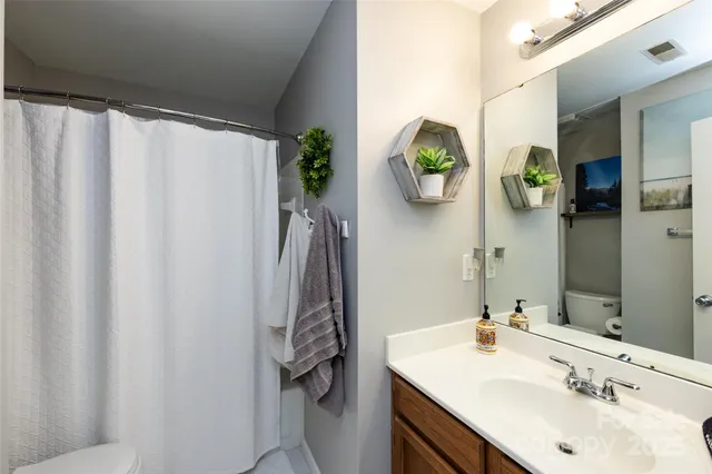 a kitchen with stainless steel appliances granite countertop a stove and a refrigerator