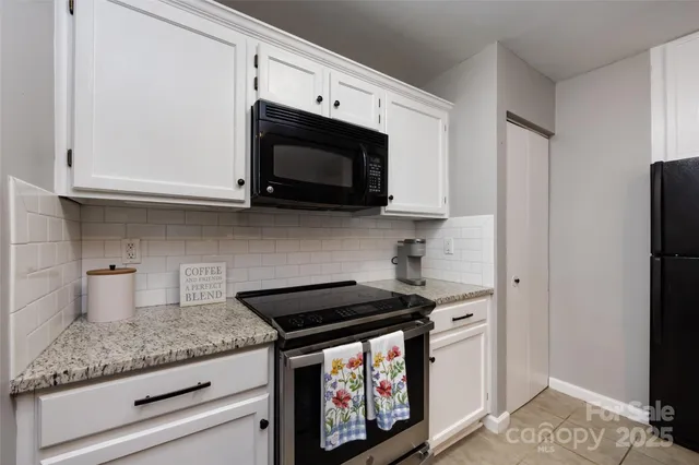 a kitchen with a sink and refrigerator