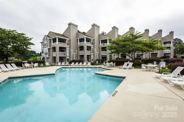 a view of swimming pool from a balcony
