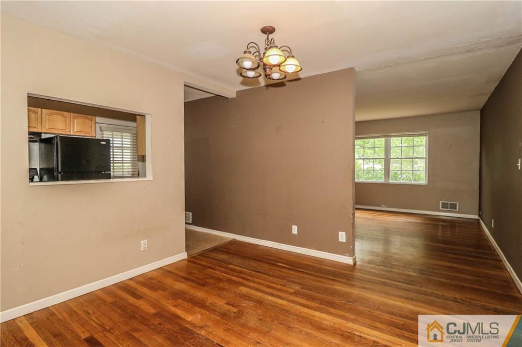 14 Fordham Road Old Bridge, NJ 08859 - Photo 5 of 22 a view of empty room with wooden floor and fan