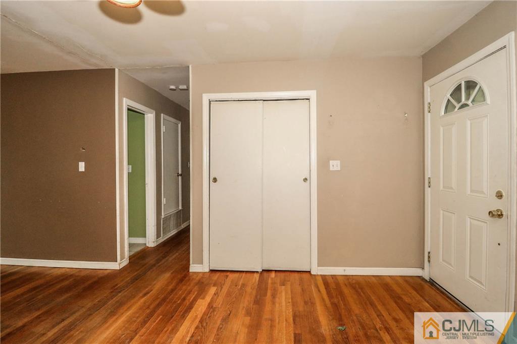 14 Fordham Road Old Bridge, NJ 08859 - Photo 6 of 22 a view of an empty room with wooden floor