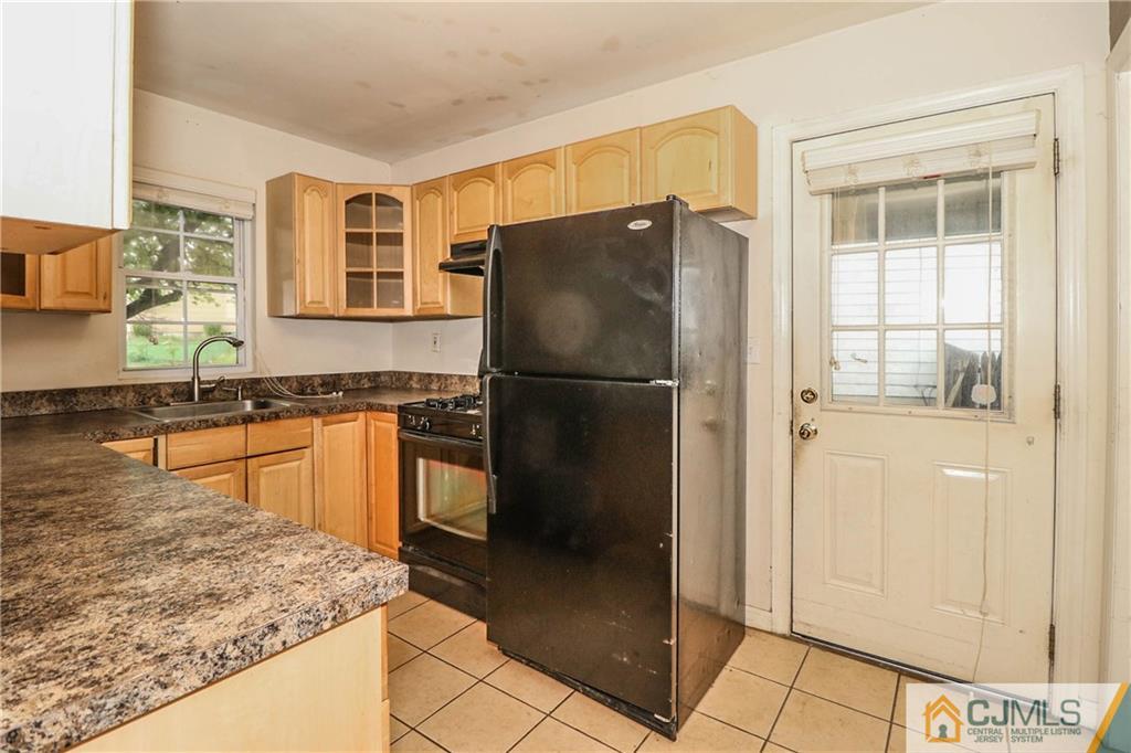 14 Fordham Road Old Bridge, NJ 08859 - Photo 8 of 22 a kitchen with granite countertop a refrigerator and a sink