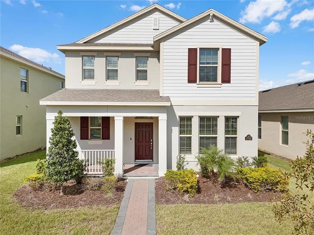 an aerial view of a house with a swimming pool