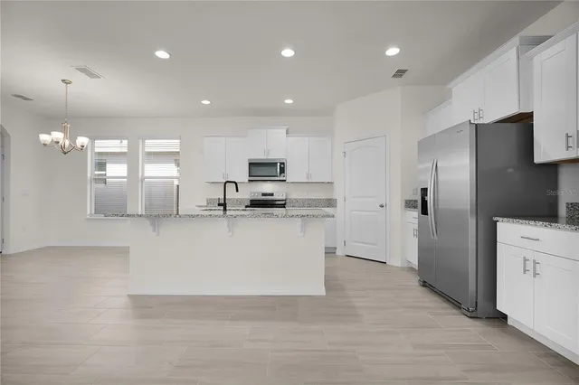 a view of an empty room and closet area