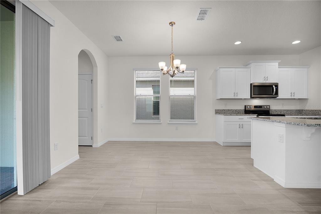 Undisclosed Address Winter Garden, FL 34787 - Photo 17 of 46 a view of a kitchen with a sink and dishwasher a refrigerator with white cabinets