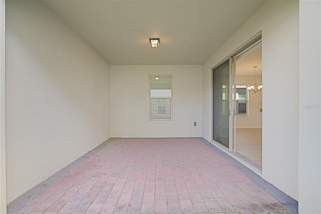 Undisclosed Address Winter Garden, FL 34787 - Photo 19 of 46 a view of an empty room with wooden floor and a window
