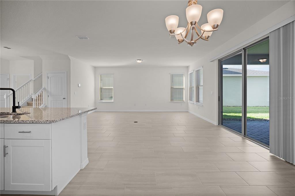 Undisclosed Address Winter Garden, FL 34787 - Photo 22 of 46 a view of a kitchen with a sink and chandelier