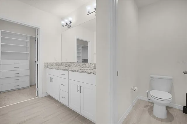 an aerial view of a residential houses with outdoor space