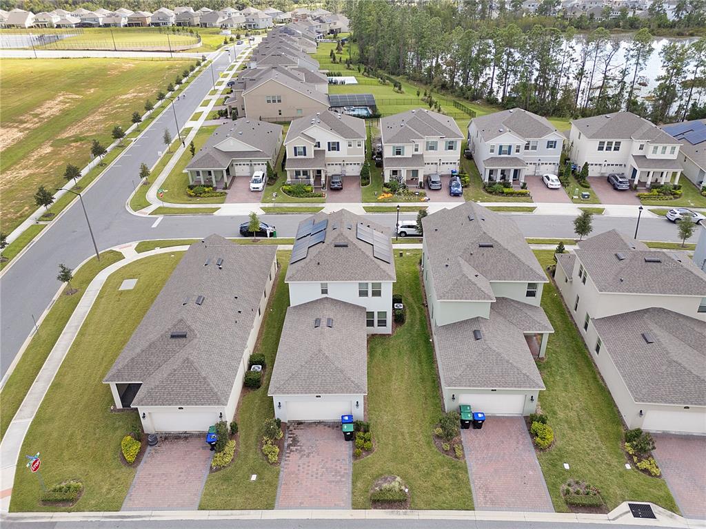 Undisclosed Address Winter Garden, FL 34787 - Photo 3 of 46 an aerial view of residential houses with outdoor space and ocean view