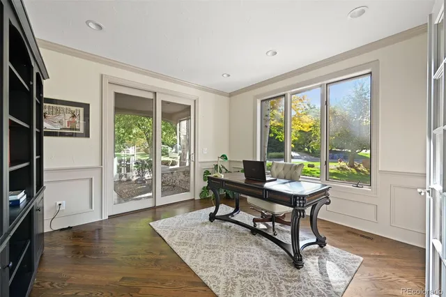 a large kitchen with granite countertop lots of counter space windows and furniture