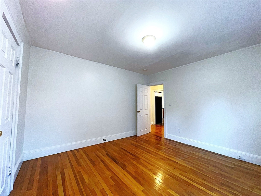 6 Oxford Avenue, Unit SIX Belmont, MA 02478 - Photo 7 of 13 a view of a room with wooden floor
