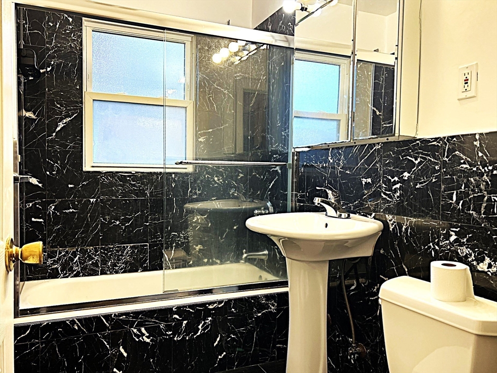 6 Oxford Avenue, Unit SIX Belmont, MA 02478 - Photo 9 of 13 a bathroom with a sink and a mirror