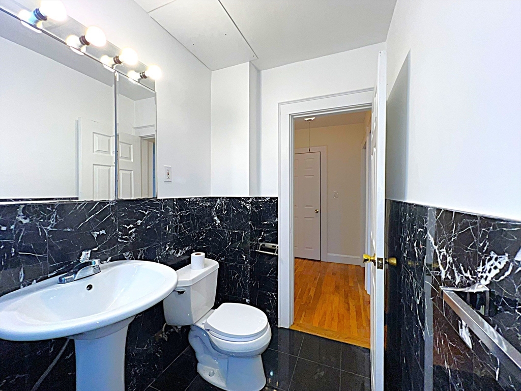 6 Oxford Avenue, Unit SIX Belmont, MA 02478 - Photo 10 of 13 a bathroom with a sink toilet and mirror
