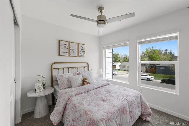 a bed room with a bed and a window