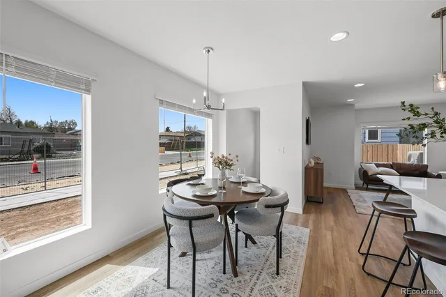 a view of a dining room with furniture window and outside view