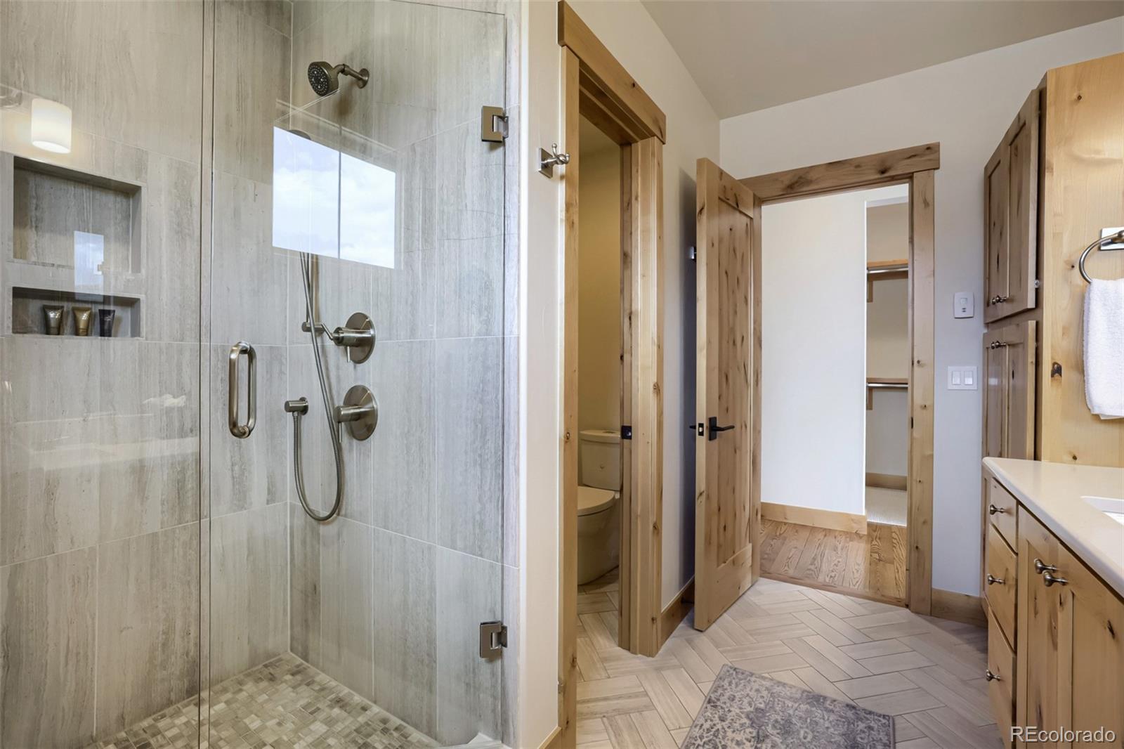 836 Maryland Creek Road Silverthorne, CO 80498 - Photo 22 of 49 a bathroom with a shower and a sink