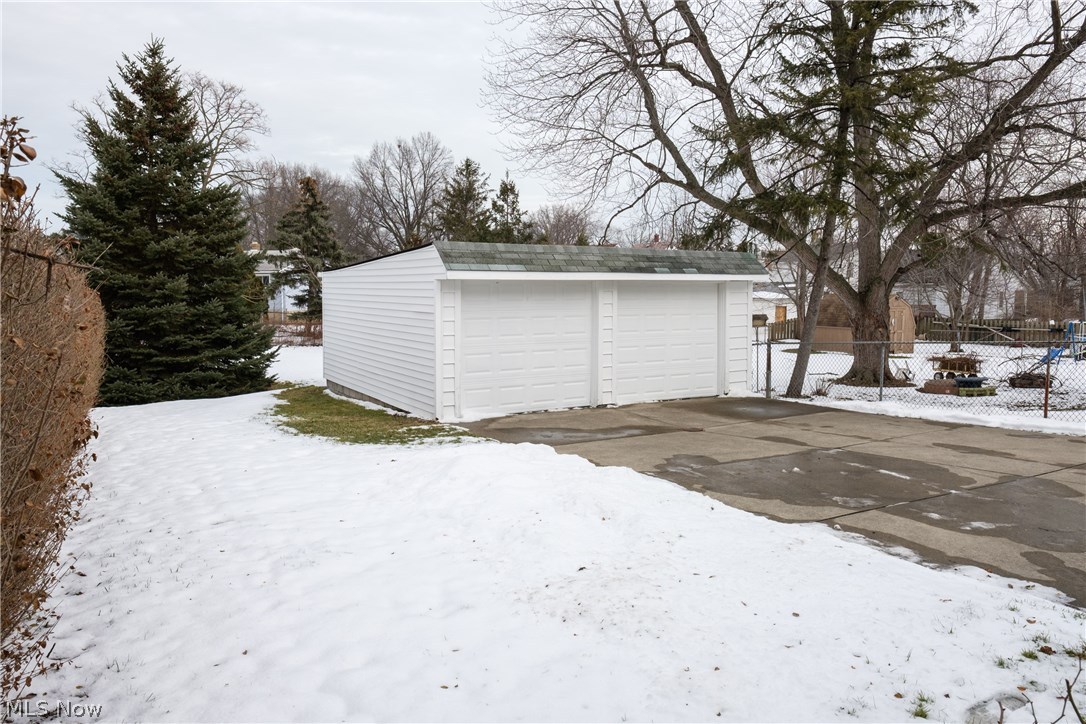 13909 Granger Road Cleveland, OH 44125 - Photo 29 of 35 Behind the garage is a deep, fenced back yard