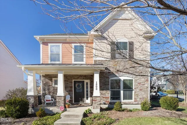 a front view of a building with garden