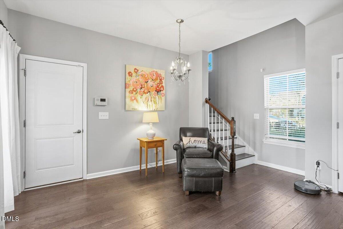 1500 Hemby Ridge Lane Morrisville, NC 27560 - Photo 12 of 50 a view of a livingroom with furniture a ceiling fan and wooden floor