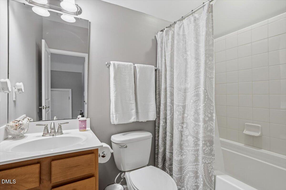 1500 Hemby Ridge Lane Morrisville, NC 27560 - Photo 27 of 50 a bathroom with a sink toilet and shower