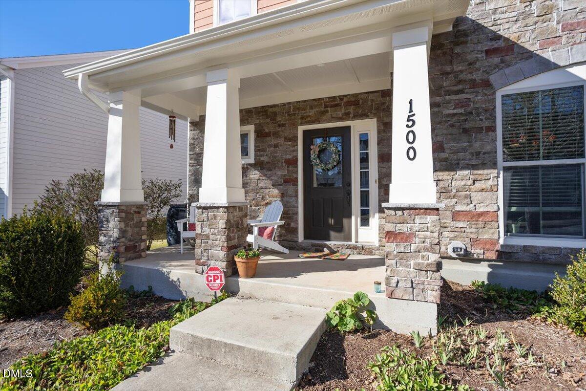 1500 Hemby Ridge Lane Morrisville, NC 27560 - Photo 3 of 50 a front view of a house with outdoor seating
