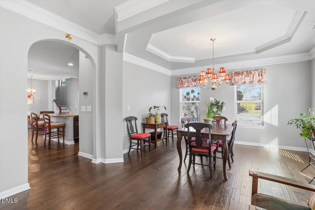 1500 Hemby Ridge Lane Morrisville, NC 27560 - Photo 5 of 50 a view of a dining room with furniture window and wooden floor