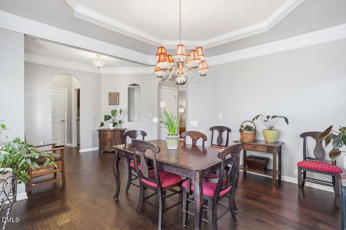 1500 Hemby Ridge Lane Morrisville, NC 27560 - Photo 7 of 50 a view of a dining room with furniture and wooden floor