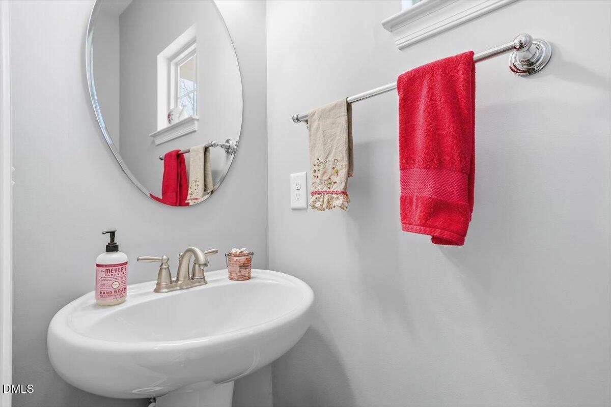 1500 Hemby Ridge Lane Morrisville, NC 27560 - Photo 8 of 50 a bathroom with a sink and a mirror
