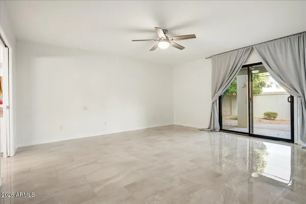 a view of an empty room with a window
