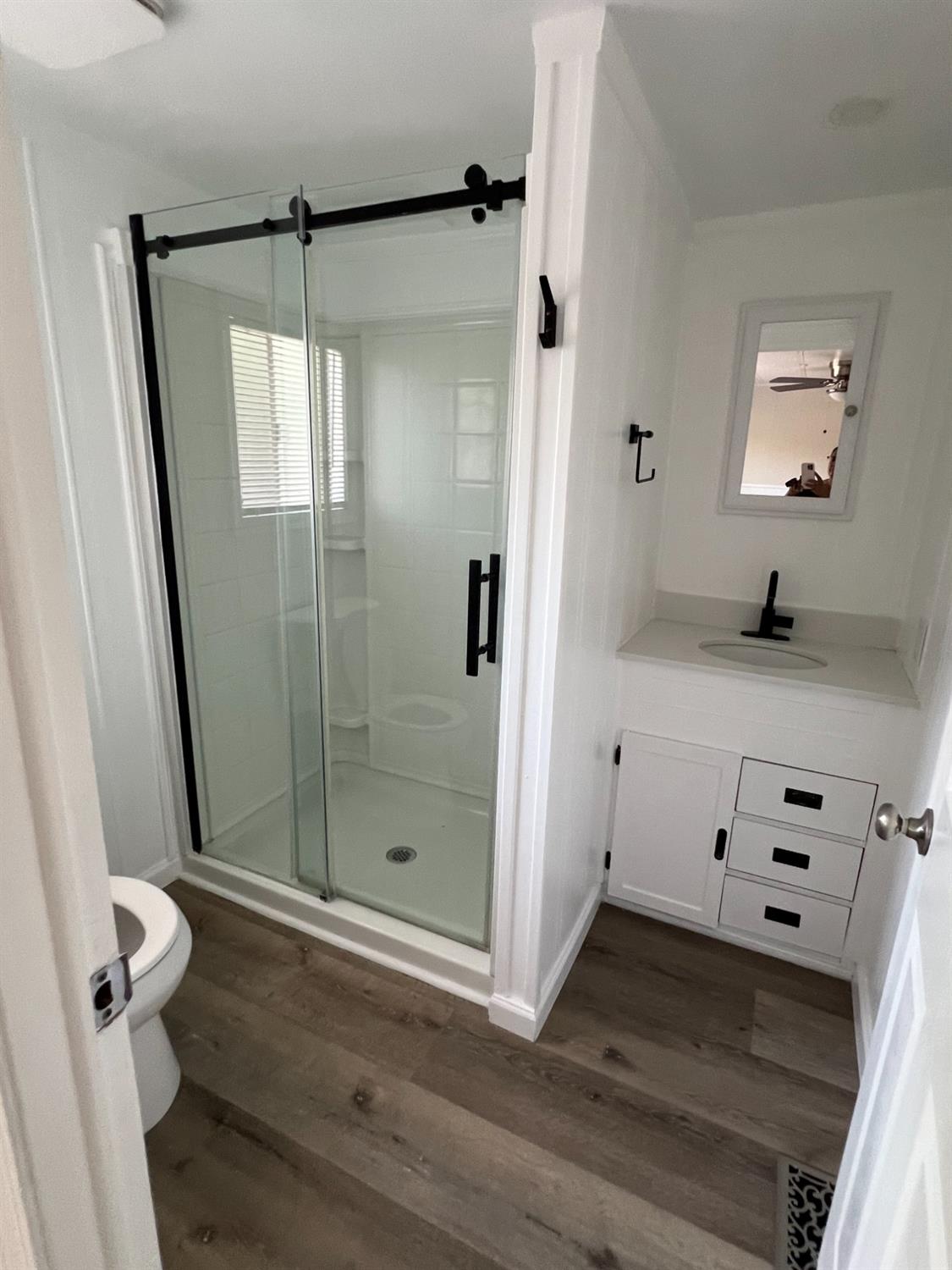 2110 Helm Avenue, Unit 48 Clovis, CA 93612 - Photo 6 of 9 a bathroom with a shower and a sink