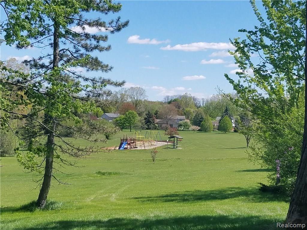 36214 Smithfield Road Farmington, MI 48335 - Photo 35 of 41 community has 2 playscapes, 2 miles of paved paths, community picnics and movie night