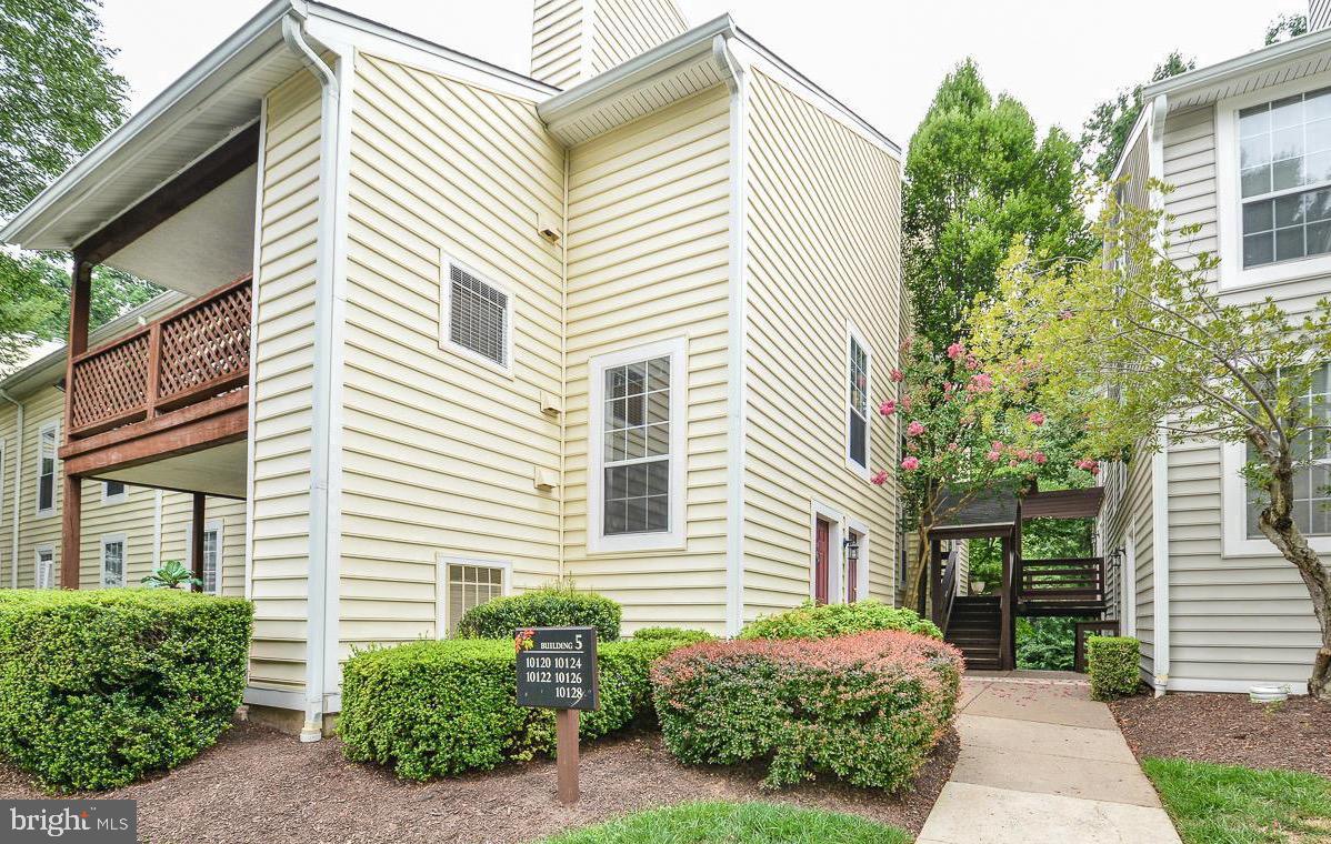 10124 Oakton Terrace Road Oakton, VA 22124 - Photo 1 of 1 a view of a house with a backyard