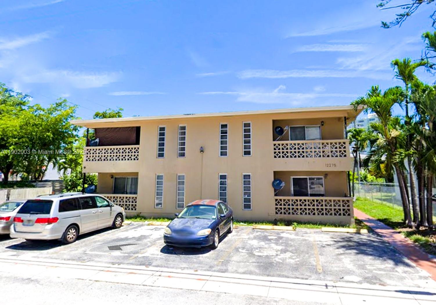 12275 Northeast 19th Avenue, Unit 6 North Miami, FL 33181 - Photo 3 of 12 a view of building with car parked