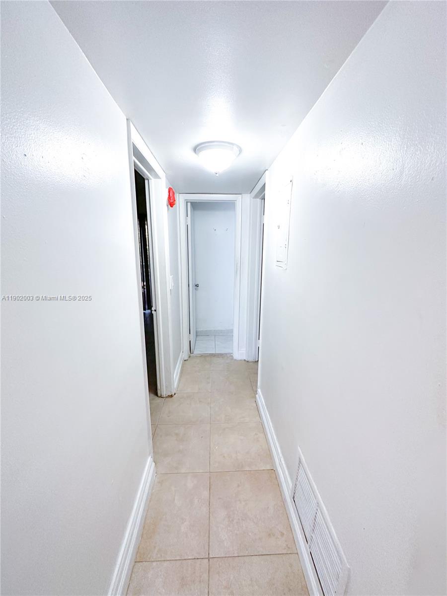 12275 Northeast 19th Avenue, Unit 6 North Miami, FL 33181 - Photo 4 of 12 a view of a hallway