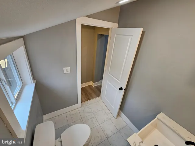 a bathroom with a toilet and a sink