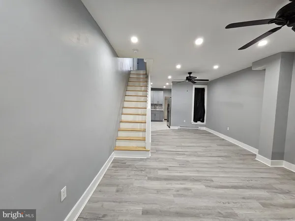 a view of entryway with wooden floor