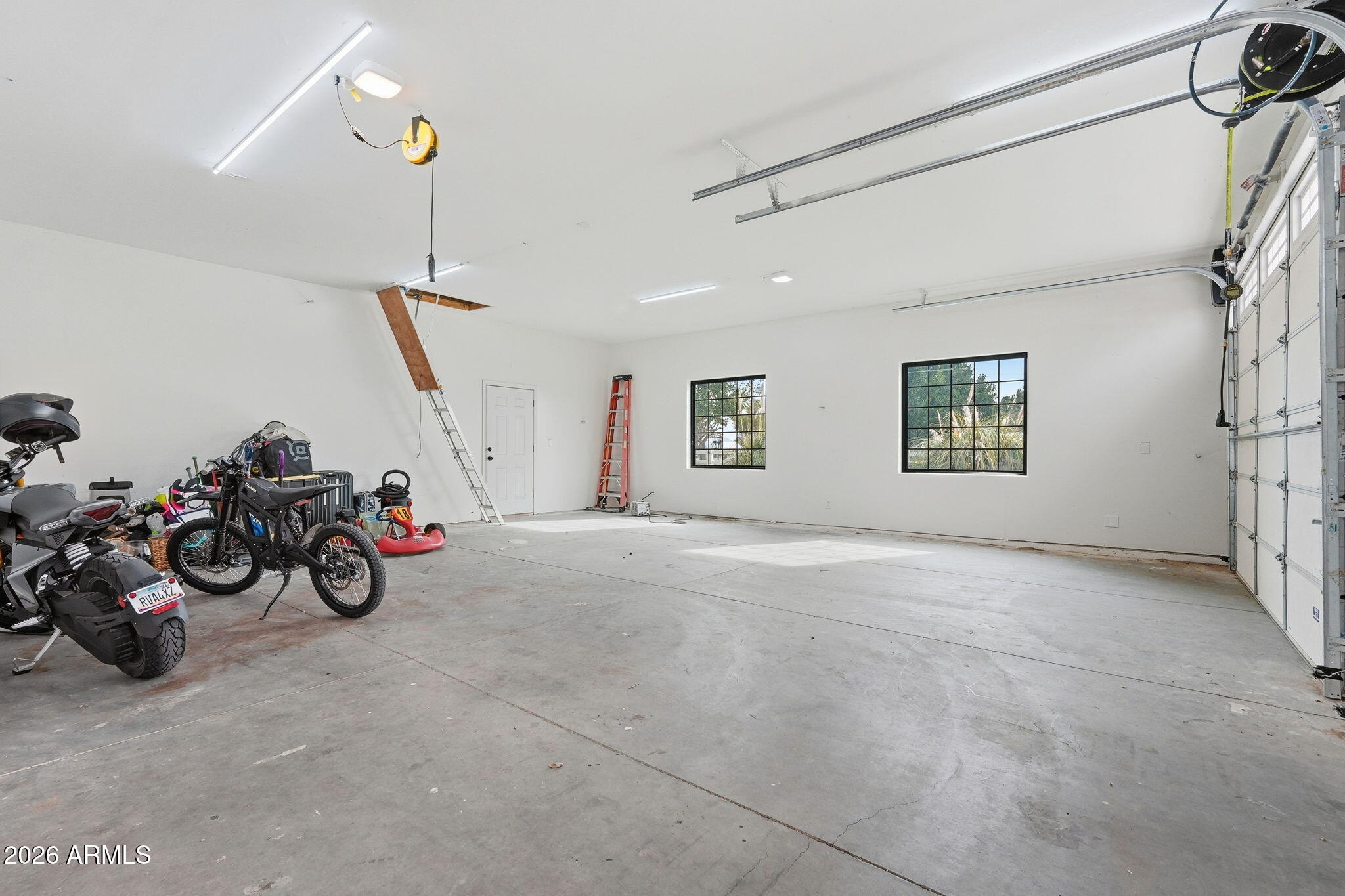 2858 East Redfield Road Gilbert, AZ 85234 - Photo 43 of 60 a view of a garage with a white car parked