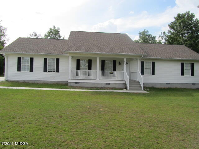 1383 Hamlin Road Lizella, GA 31052 - Photo 1 of 15 a front view of a house with swimming pool