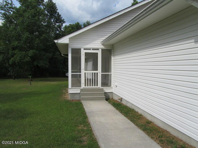 1383 Hamlin Road Lizella, GA 31052 - Photo 2 of 15 a view of a house with a yard