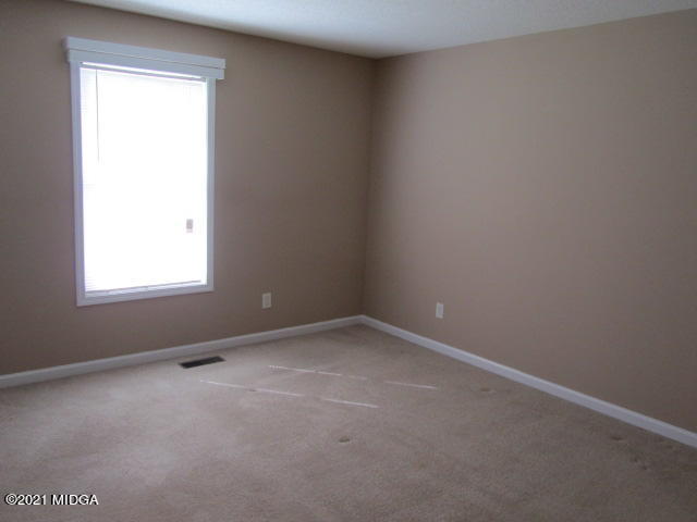 1383 Hamlin Road Lizella, GA 31052 - Photo 11 of 15 an empty room with a window