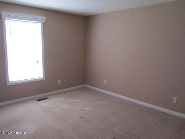 1383 Hamlin Road Lizella, GA 31052 - Photo 13 of 15 an empty room with a window