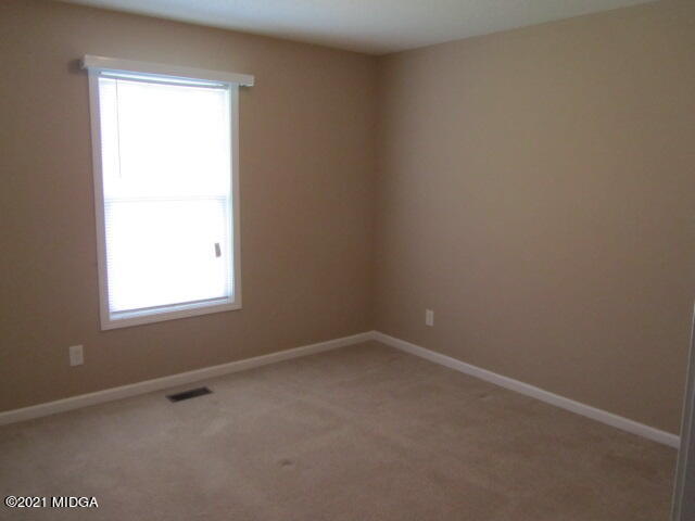 1383 Hamlin Road Lizella, GA 31052 - Photo 14 of 15 an empty room with a window